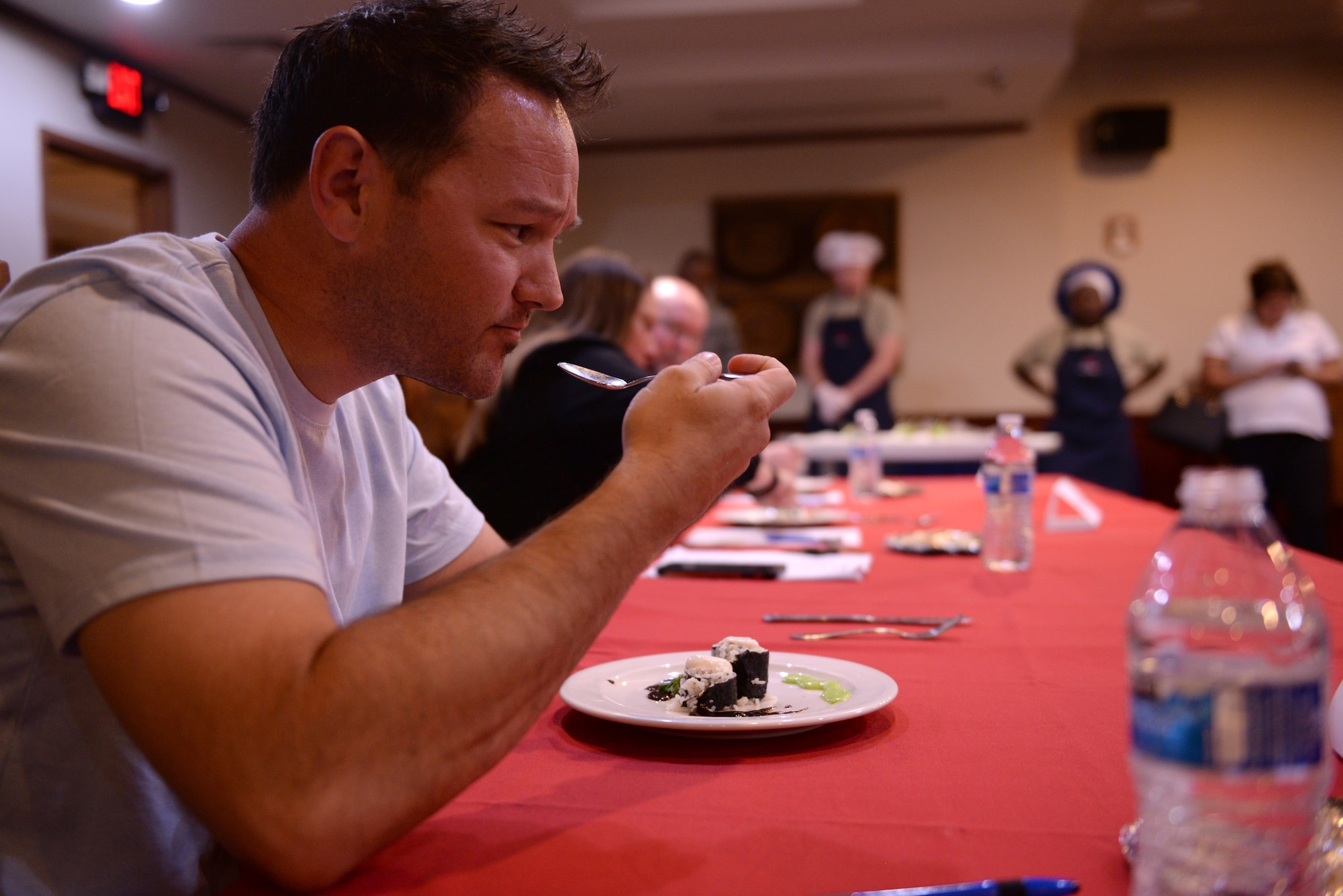 Joe Lucidi, a local restaurant owner, judges an appetizer during the Taste of Luke cooking competition at Luke Air Force Base, Ariz., May 9, 2018. Lucidi was one of three guest judges, the other two were also from local restaurants. (U.S. Air Force photo by Senior Airman Ridge Shan)