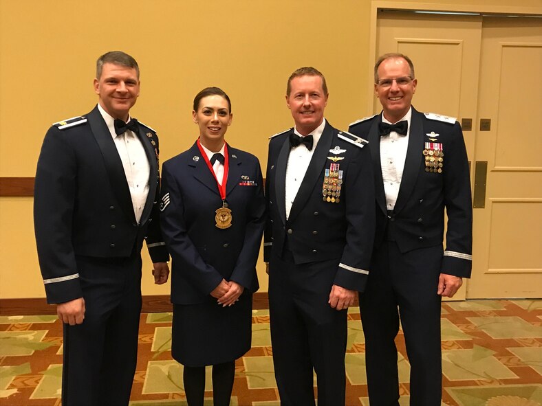 Staff Sgt. Kristin Feldner, 919th Special Operations Logistics Readiness Squadron, poses for a photo moments after receiving her award as one Air Force Special Operations Command’s Outstanding Airmen of the Year May 9, 2018 at Hurlburt Field, Florida