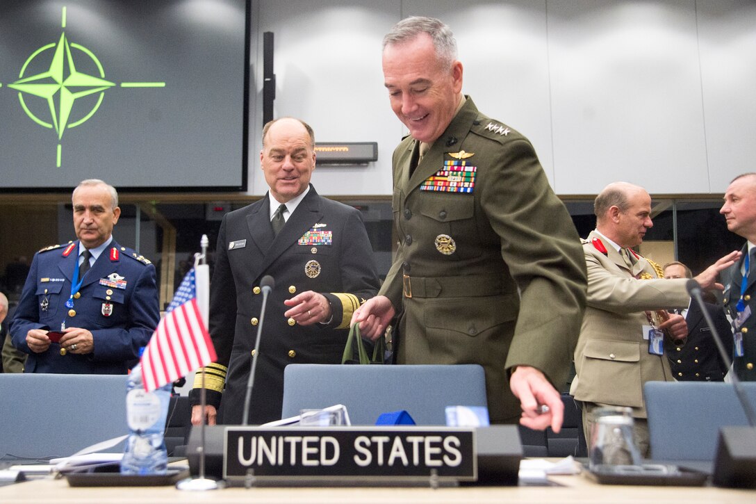 Marine Corps Gen. Joe Dunford, chairman of the Joint Chiefs of Staff, arrives at a NATO meeting.