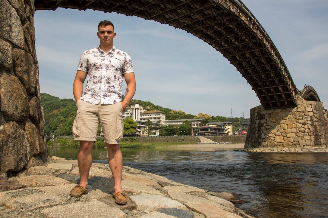 U.S. Marine Corps Cpl. Dawson Hatzman, an engineer assistant with Marine Wing Support Squadron (MWSS) 171, stands under the Kintaikyo Bridge for a photo in Iwakuni City, Japan, May 1, 2018. Hatzman helped a local Japanese boatman free his boat from the current in the Nishiki River during Easter weekend. (U.S. Marine Corps photo by Lance Cpl. Lauren Brune)