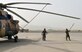 An Afghan Air Force maintenance professional tie down the propellers of an Mi-17 at Kandahar Airfield, Afghanistan, May 7, 2018. This was one of six Mi-17s that received damage from aggressors so far this year, but after extensive sheet metal repairs, the aircraft are all continuing operational missions. (U.S. Air Force photo/1st Lt. Erin Recanzone)