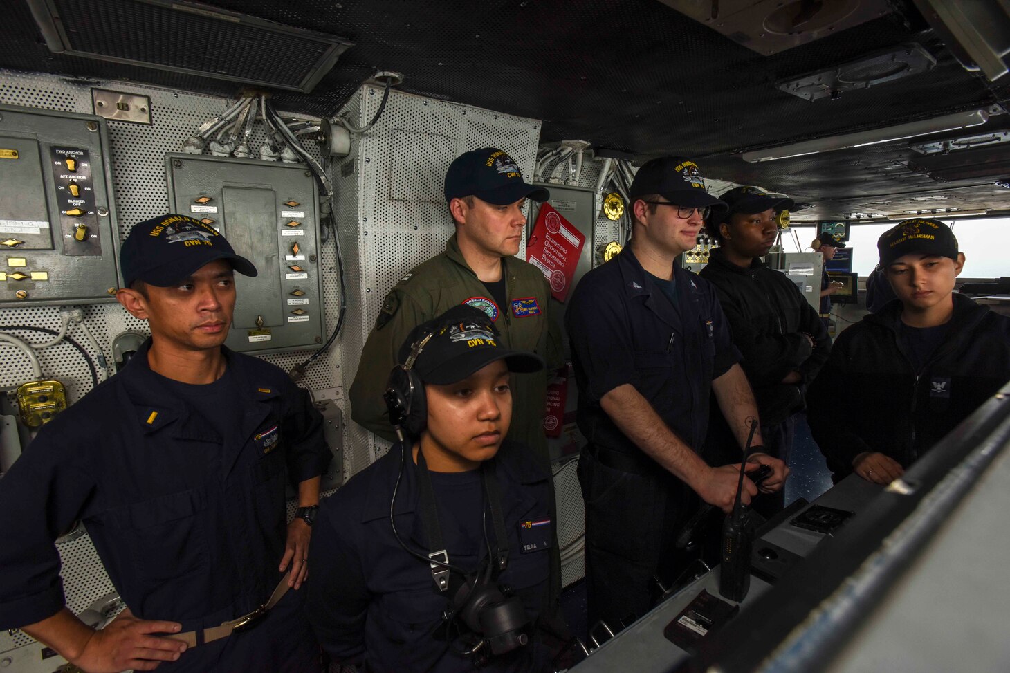 Sailors stand watch on the bridge of Navy's forward-deployed aircraft carrier, USS Ronald Reagan (CVN 76), as the ship returns to Commander, Fleet Activities Yokosuka following sea trials. Ronald Reagan, the flagship of Carrier Strike Group 5, provides a combat-ready force that protects and defends the collective maritime interests of its allies and partners in the Indo-Asia-Pacific region.