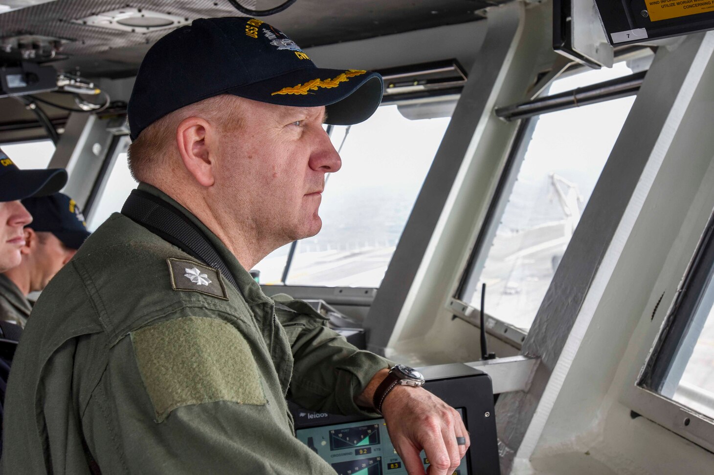 Cmdr. Stephen Weeks, navigator aboard the Navy's forward-deployed aircraft carrier, USS Ronald Reagan (CVN 76), monitors the ships course as Ronald Reagan returns to Commander, Fleet Activities following sea trials. Ronald Reagan, the flagship of Carrier Strike Group 5, provides a combat-ready force that protects and defends the collective maritime interests of its allies and partners in the Indo-Asia-Pacific region.