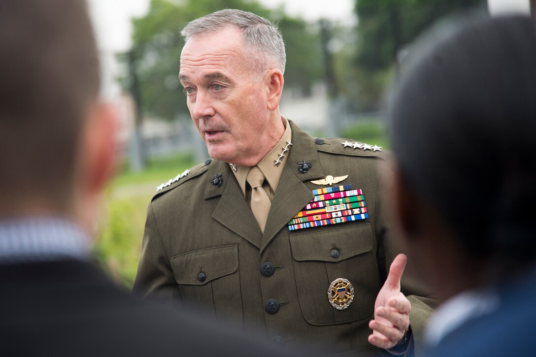 Marine Corps Gen. Joe Dunford speaks to a group of people in Brussels