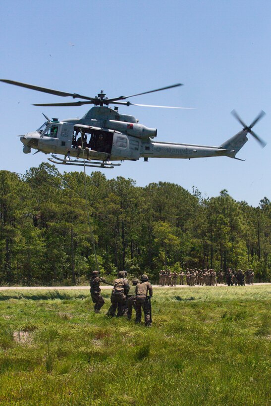 French Marines hold a rope after fast roping from a UH-1Y helicopter during exercise Burmese Chase at Camp Lejeune, N.C., May 11, 2018. Burmese Chase is an annual U.S. led multi-lateral exercise that enables U.S. Marines to train with NATO allies and partner nations. This exercise strengthens partner nation security as well as enhances force readiness.