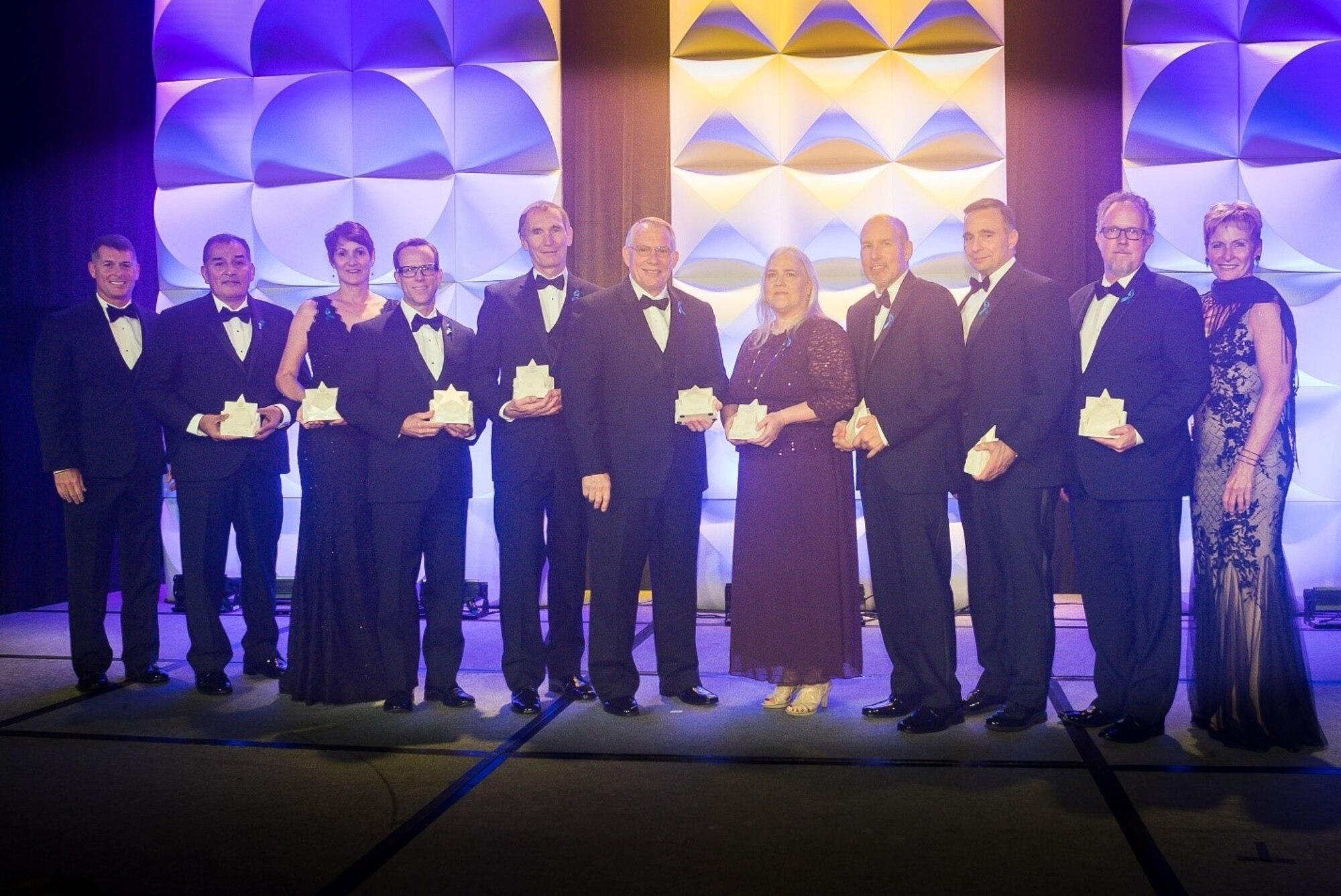 Air Force Research Laboratory Space Vehicles Directorate physicist David Wilt, second from right, won a Late Career Stellar Award at the Rotary National Award for Space Achievement ceremony. Wilt is pictured with all of the Late Career Stellar award winners. The group is flanked by NASA astronauts Col. (ret) R. Shane Kimbrough and Dr. Peggy Whitson.