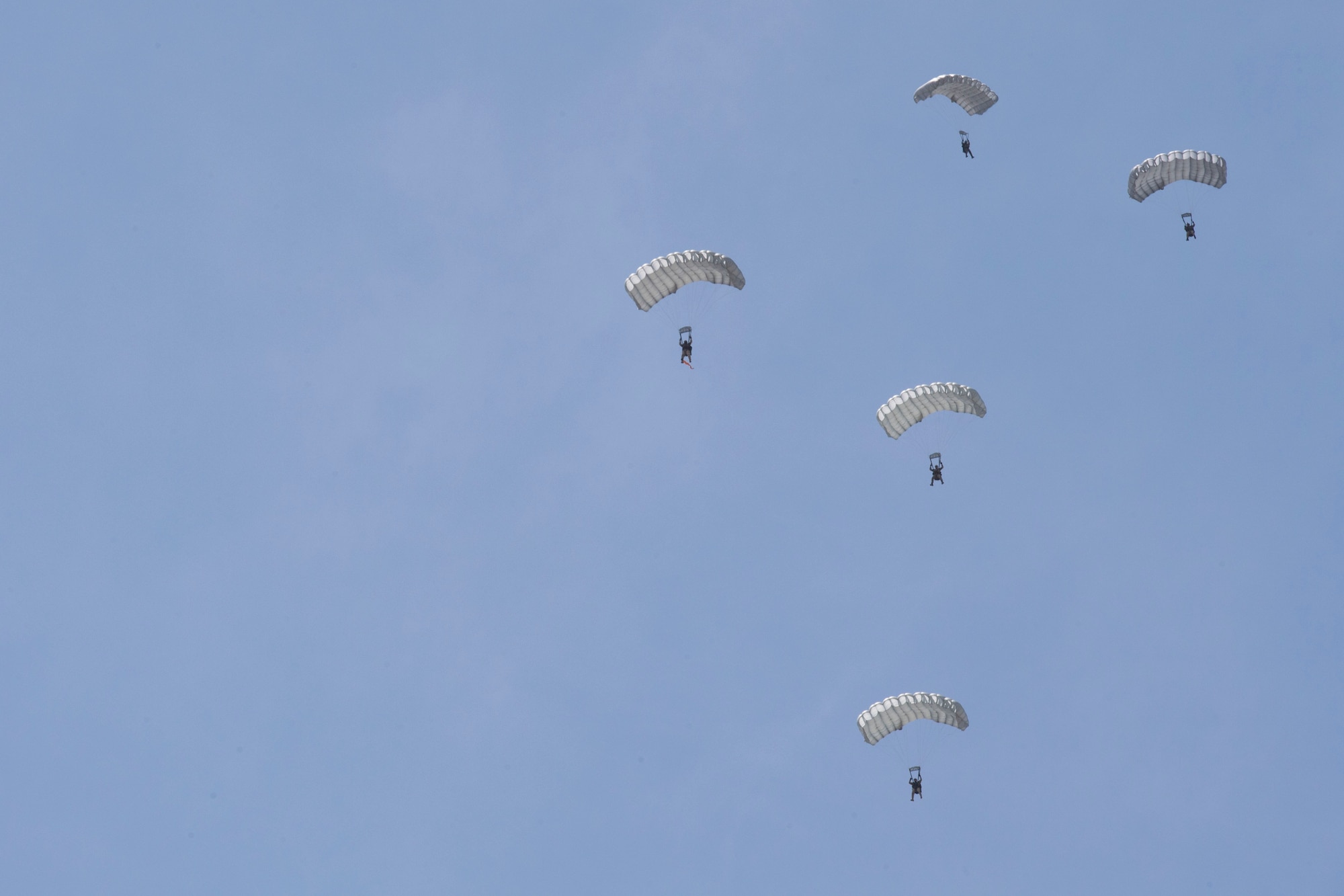 Hellenic paratroopers conduct High Altitude Low Opening jumps during exercise Stolen Cerberus V, over Megara Drop Zone, Greece, May 15, 2018. The United States and Greece share a commitment to promote peace and stability in the European theater, and continue to seek opportunities to develop strong relationships. (U.S. Air Force photo by Senior Airman Devin M. Rumbaugh)