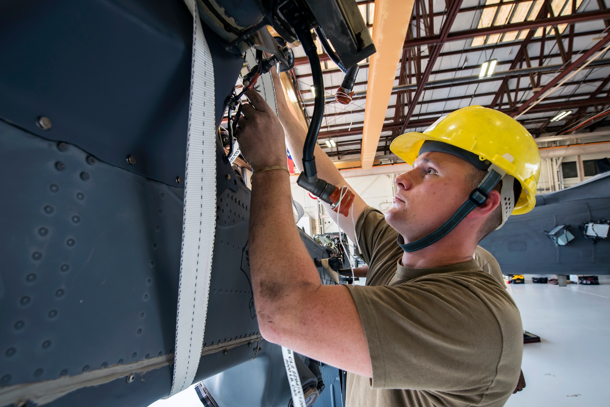 Staff Sgt. David Melton, 723d Aircraft Maintenance Squadron (AMXS) crew chief, inspects an HH-60G Pave Hawk tail pylon, May 10, 2018, at Moody Air Force Base, Ga. Airmen from the 723d AMXS along with machinists from the Corpus Christi Army Depot conducted a full-structural tear down and restoration on an HH-60G Pave Hawk. Once the aircraft was torn down, Airmen and the machinists performed repairs on all of its components prior to resembling it. (U.S. Air Force photo by Airman 1st Class Eugene Oliver)