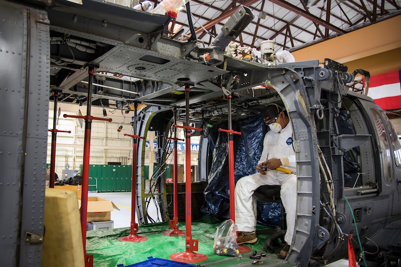 Erasmo Leal, a machinist from the Corpus Christi Army Depot (CCAD), inspects his tools, May 15, 2018, at Moody Air Force Base, Ga. Airmen from the 723d Aircraft Maintenance Squadron along with machinists from the CCAD conducted a full-structural tear down and restoration on an HH-60G Pave Hawk. Once the aircraft was torn down, Airmen and the machinists performed repairs on all of its components prior to resembling it. (U.S. Air Force photo by Airman 1st Class Eugene Oliver)