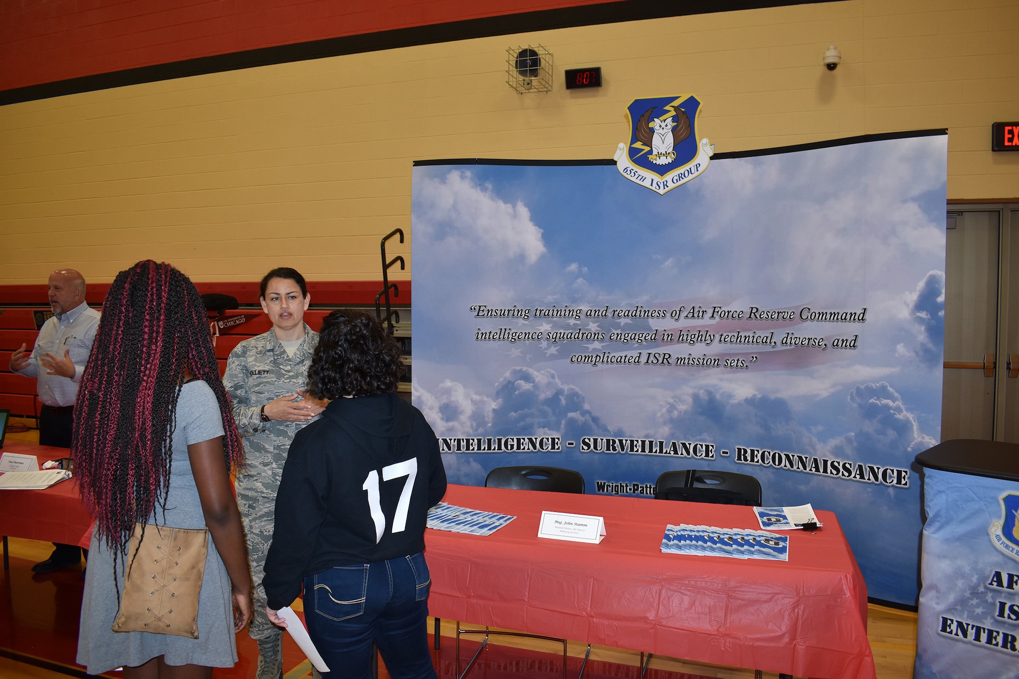 655th Intelligence, Surveillance and Reconnaissance Group reservist Tech. Sgt. Folliett talks with students from Weisborn Jr. High, Huber Heights, Ohio, during the school’s career day fair May 8, 2018.