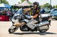Utah Highway Patrol Officer Andrew Pollard demonstrates bike handling techniques during the 4th annual Motorcycle Safety Rodeo May 16, 2018, at Hill Air Force Base, Utah. Base riders also attended one of two mandatory safety briefings given at the base theater, which included guest speakers from the Utah Highway Patrol, wing safety and base leadership. (U.S. Air Force photo by R. Nial Bradshaw)