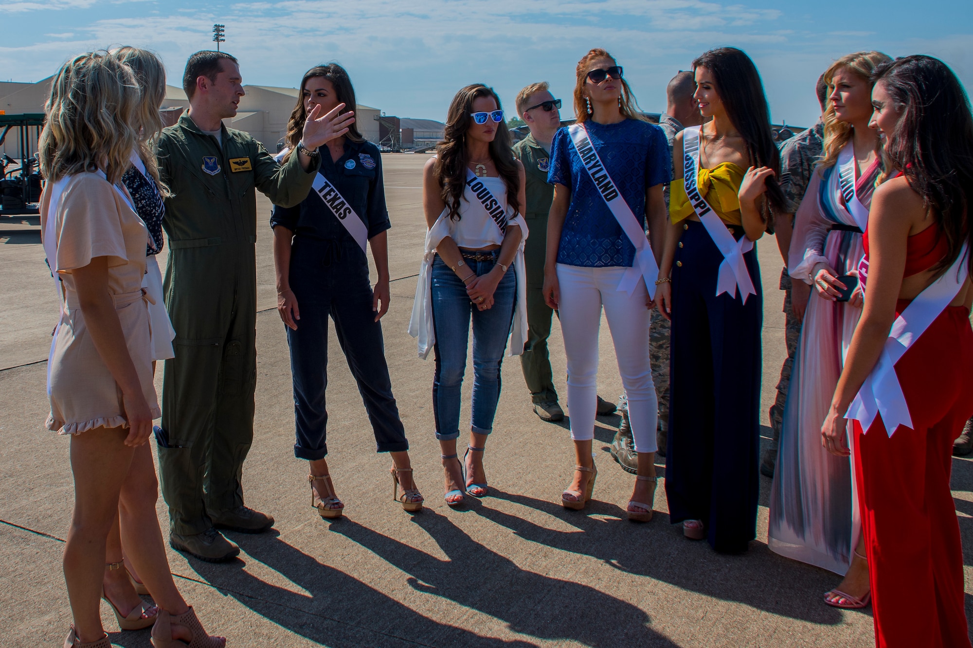 U.S. Air Force Capt. Bryan Freeman, 11th Bomb Squadron pilot, tells contestants in the 2018 Miss USA pageant about the B-52 Stratofortress during their visit to Barksdale Air Force Base, Louisiana, May 15, 2018.