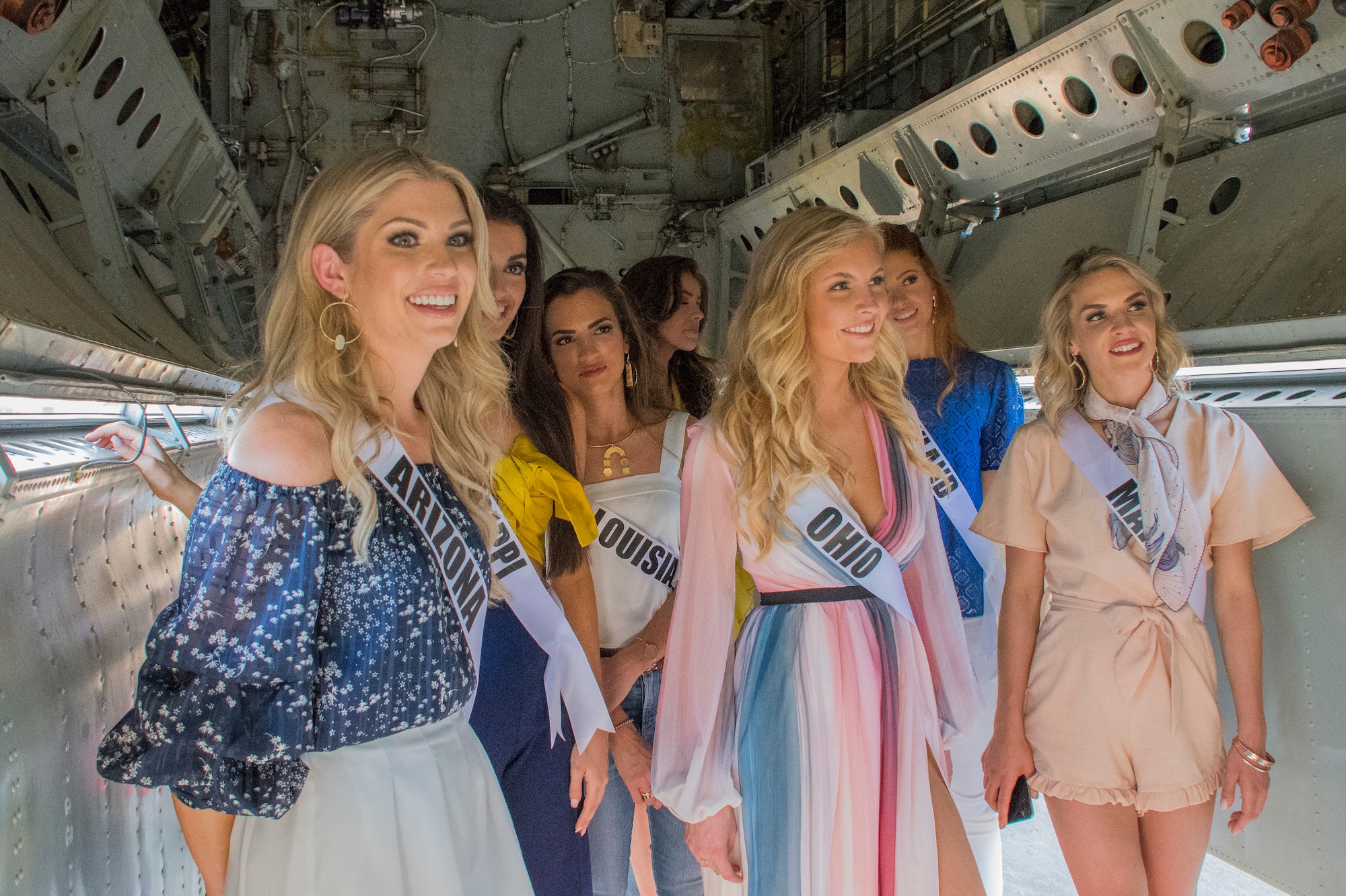 Contestants in the 2018 Miss USA pageant look inside the bomb bay of a B-52 Stratofortress during their visit to Barksdale Air Force Base, Louisiana, May 15, 2018.