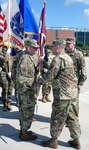 Maj. Gen. Thomas Tempel, Regional Health Command-Central commanding general, passes the colors to incoming Brooke Army Medical Center commander Brig. Gen. George “Ned” Appenzeller May 11 during a simultaneous change of command and change of responsibility ceremony on the hospital’s ground helipad. Brig. Gen. Jeffrey Johnson relinquished command to Appenzeller and Command Sgt. Maj. Diamond Hough relinquished responsibility to Command Sgt. Maj. Thomas Oates during the ceremony.