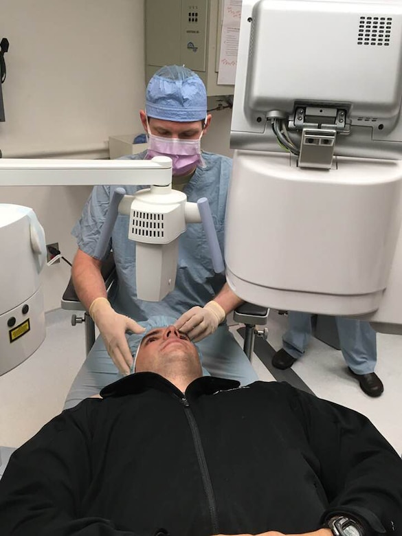 Air Force Maj. (Dr.) Marc Neuffer, chief of cornea and refractive surgery at the U.S. Air Force Academy’s 10th Medical Group, prepares to perform collagen crosslinking on patient Air Force Capt. Brent Danner.