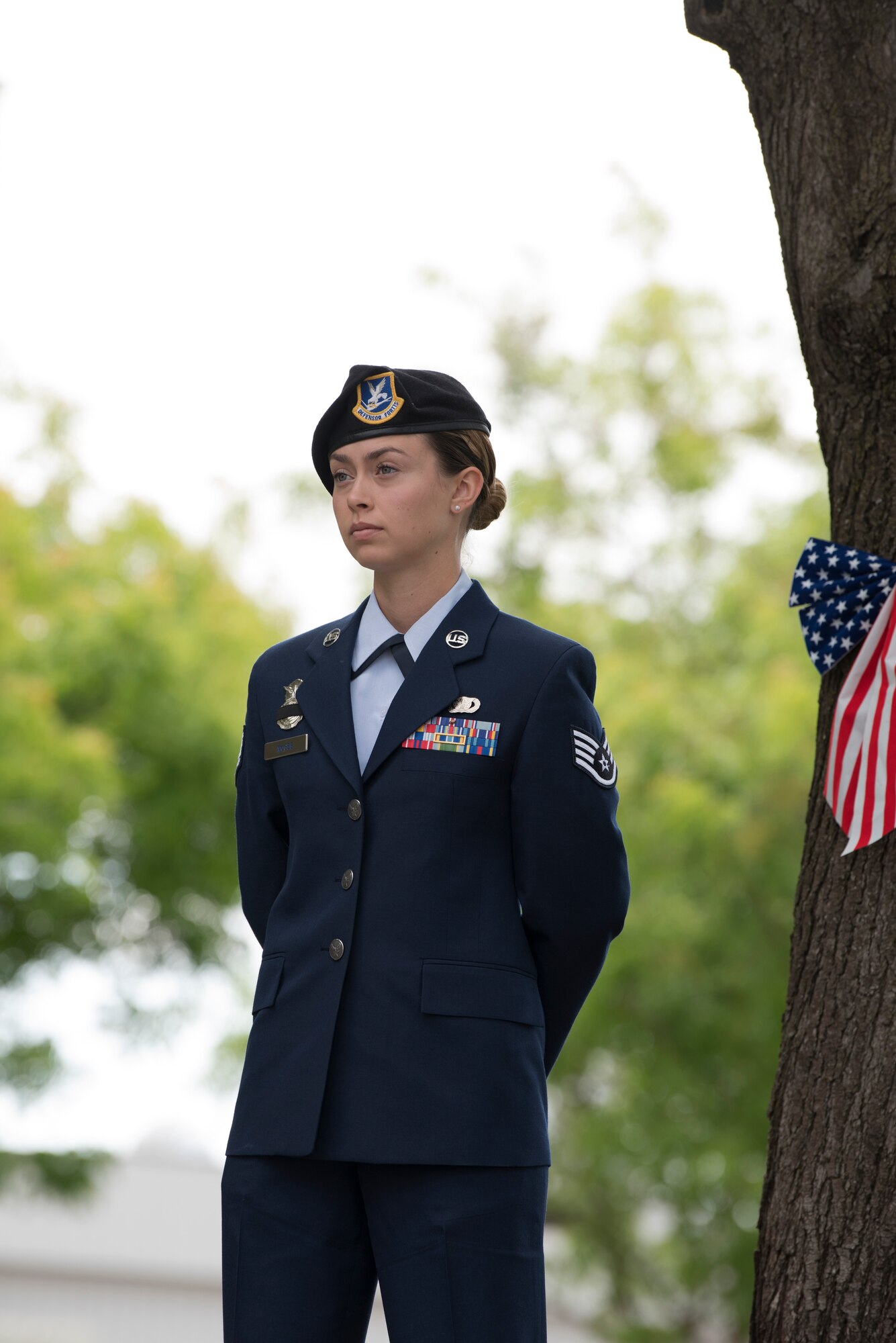 Staff Sgt. Callie McGee, 60th Security Forces Squadron Standardization and Evaluation evaluator, stands at parade rest during the 29th Annual Peace Officer’s Memorial Ceremony in Fairfield, Calif., May 16, 2018. Nearly a dozen security forces members participated in the ceremony to honor fallen peace officers. (U.S. Air Force photo by Tech. Sgt. James Hodgman)