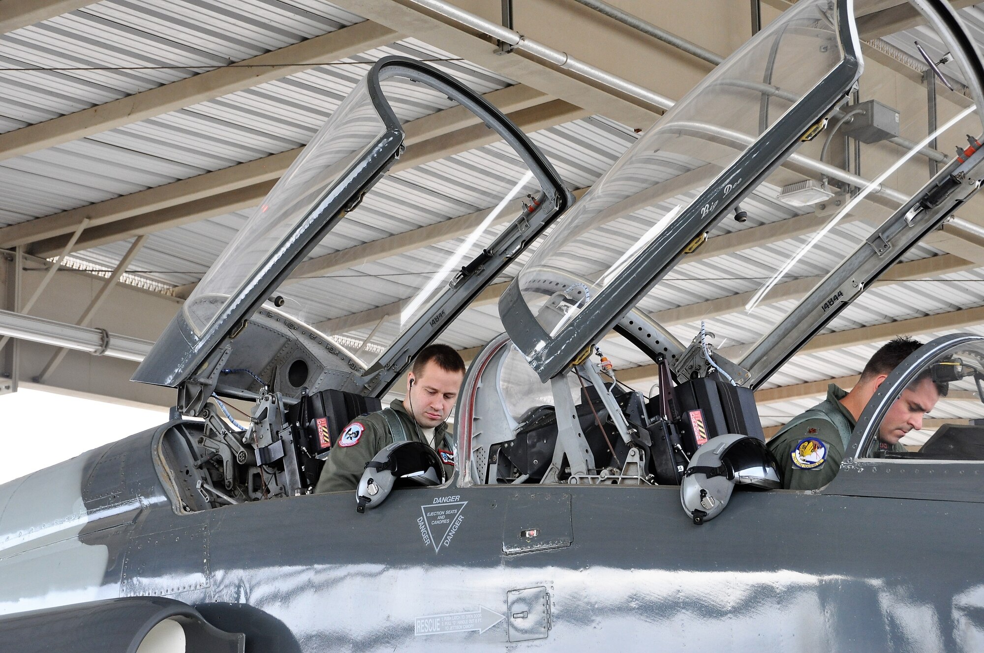 Capt. Joshua Smith and Maj. Jeff Nelson ready the T-38 for flight during the 2018 Cobras in the Clouds exercise. (U.S. Air Force photo by Janis El Shabazz)