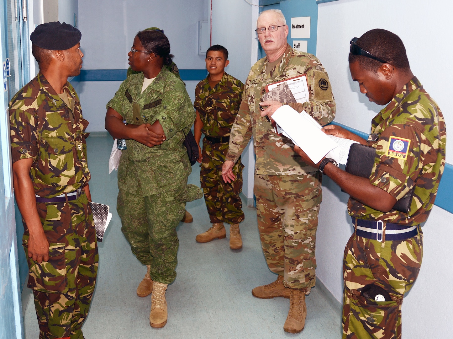 Master Sgt. Joseph Cole (center), from the U.S. Army’s Louisiana National Guard's Construction Facility Management Office, and service members from the Belize Defence Force, participate in a site survey and facility assessment exercise of a military hospital in Belize City May 9.