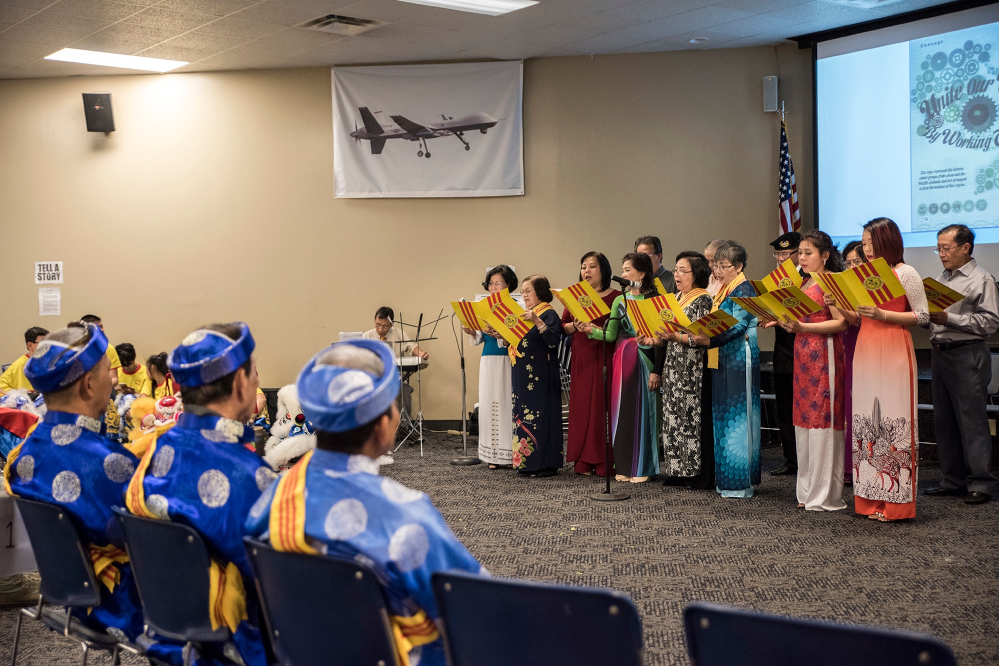 Members of the Fort Smith Vietnamese Community Center sing during the 188th Wing’s Asian American and Pacific Islander Heritage Month observance at Ebbing Air National Guard Base, Fort Smith, Ark., May 6, 2018. The event was part of the 188th Wing’s annual family day, an event designed to build morale and camaraderie for wing members and families. (U.S. Air National Guard photo by Senior Airman Matthew Matlock)