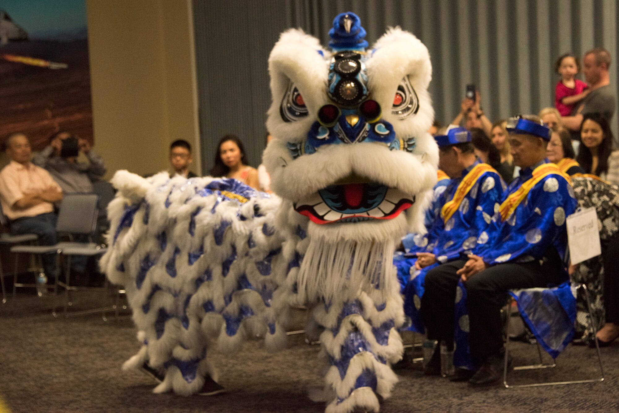 Members of the Fort Smith Vietnamese Community Center discuss their heritage and perform a traditional lion dance for members of the 188th Wing, Fort Smith, Ark., May 6, 2018, during an Asian American and Pacific Islander Heritage Month observance event. The event was part of the 188th Wing’s annual family day, an event designed to build morale and camaraderie for wing members and families. (U.S. Air National Guard photo by Tech. Sgt. Daniel Condit)