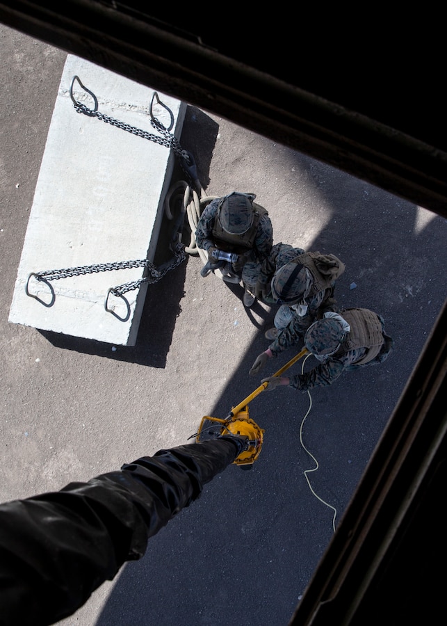 Marines with 1st Transport Support Battalion, Combat Logistics Regiment 1, 1st Marine Logistics Group, prepare to conduct air delivery operations with Marine Heavy Helicopter Squadron (HMH) 462, Marine Aircraft Group 16, 3rd Marine Aircraft Wing, at Marine Corps Base Camp Pendleton, Calif., May 15. HMH-462 conducted training implementing cargo pick-up and drop off to enhance the units’ skills and proficiency with cargo movement and operations. (U.S. Marine Corps photo by Lance Cpl. Clare J. McIntire/Released)