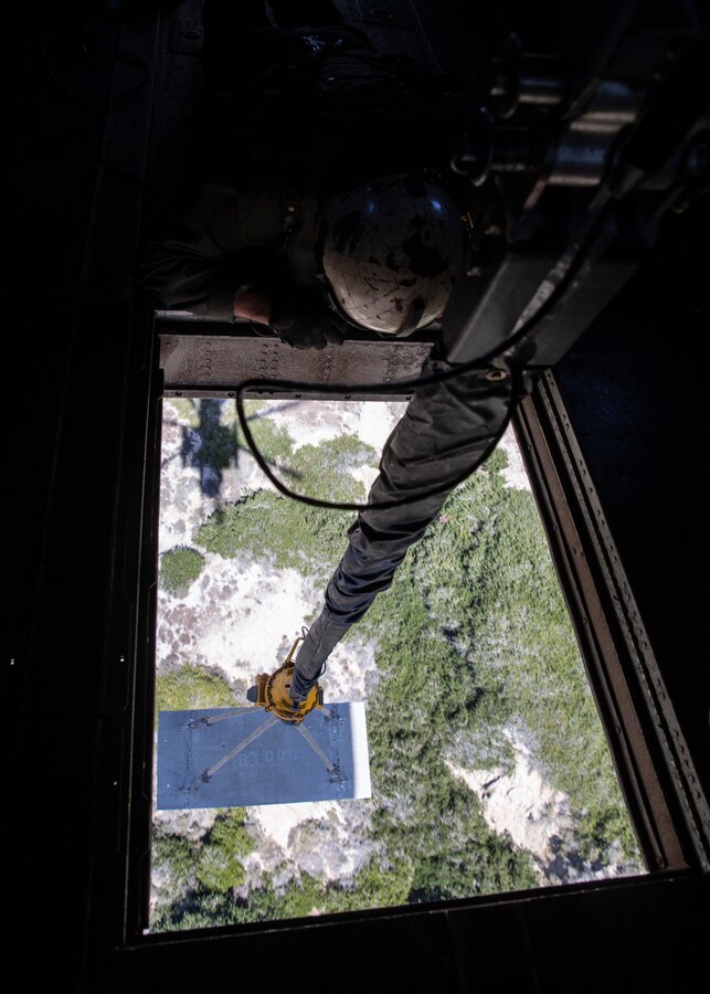 Sgt. Nathan Hardy, a CH-53E Super Stallion crew chief with Marine Heavy Helicopter Squadron (HMH) 462, Marine Aircraft Group 16, 3rd Marine Aircraft Wing, observes external lift operations at Marine Corps Base Camp Pendleton, Calif., May 15. HMH-462 conducted training implementing cargo pick-up and drop off to enhance the units’ skills and proficiency with cargo movement and operations. (U.S. Marine Corps photo by Lance Cpl. Clare J. McIntire/Released)