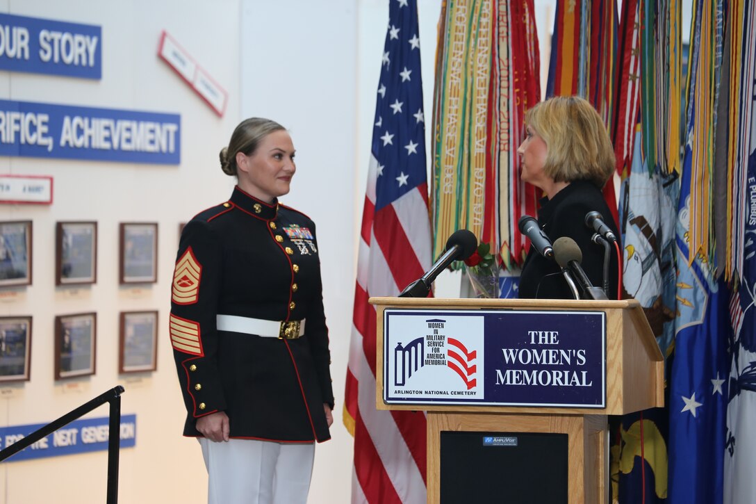 Representative Claudia Tenney, New York congresswoman, prepares to hand Master Sgt. Meghann Viggiani a rose in honor of her courage and professional achievements as the Marine Corps’ senior noncommissioned officer recognized at the Women in the Military Wreath Laying Ceremony, sponsored by the Congressional Caucus for Women’s Issues, Arlington, Virginia, May 17, 2018. Viggiani, the logistics chief at Marine Barracks Washington, was recognized at the annual ceremony.