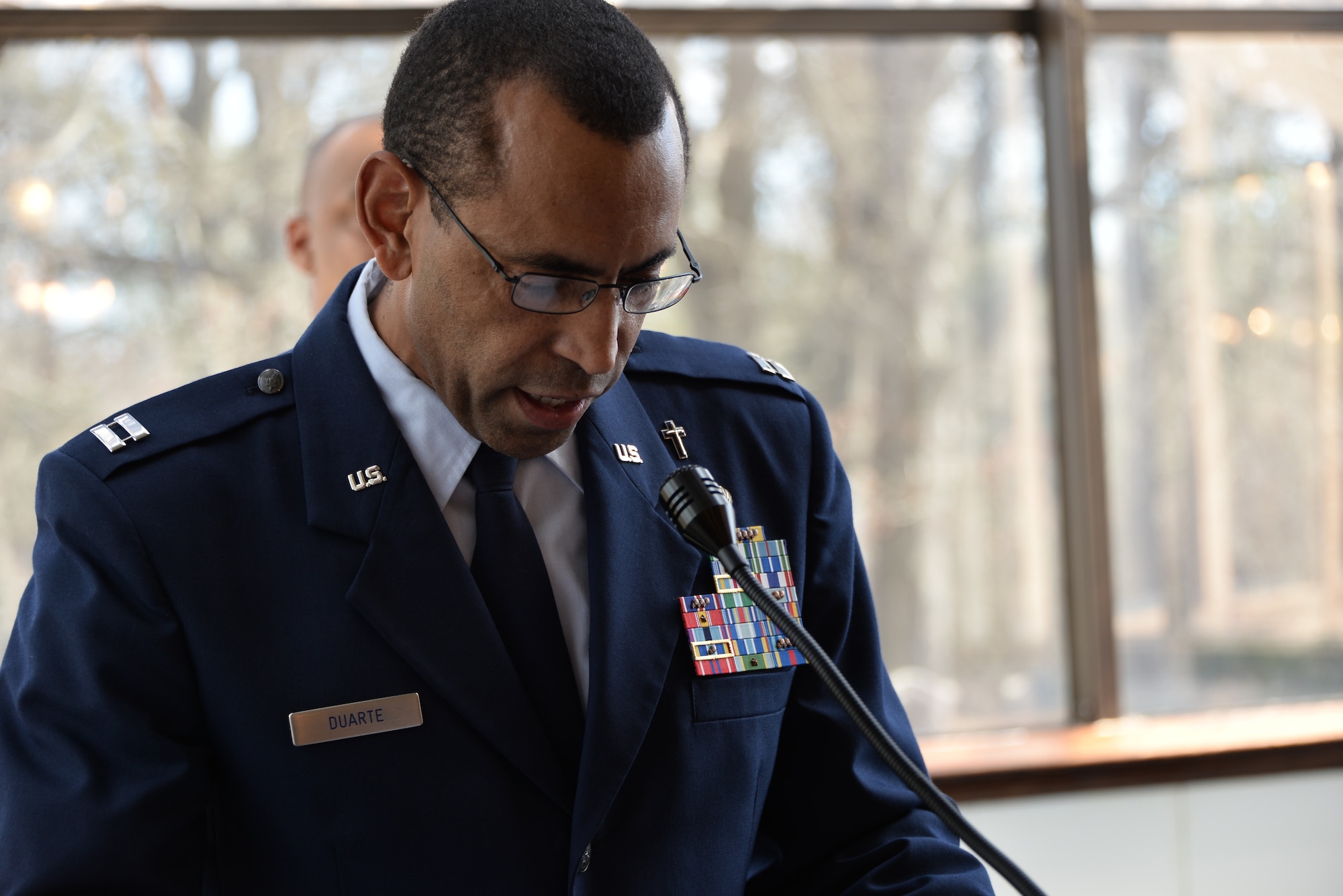 Chaplain (Capt.) Manuel Duarte, 70th Intelligence, Surveillance and Reconnaissance Wing chaplain, provides an invocation prior to a promotion ceremony Feb. 24, 2017, at Fort George. G. Meade, Maryland. Duarte is part of the 2017 Air Force Best Small Chapel team. (U.S. Air Force photo by Staff Sgt. Alexandre Montes)