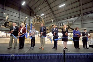 The ribbon is cut to the B-17F Memphis Belle Exhibit during a public ceremony on May 17, 2018: (left to right) Brian Pecon (Memphis Belle Memorial Association President), Col. Susan Richardson, USAF (Ret) (Chairman of the Air Force Museum Foundation Board of Trustees), Thomas Harrison (Student from England), Lt. Gen. Jack Hudson, USAF (Ret) (Museum Director), Lt. Gen. Jacqueline Van Ovost (Air Force Director of Staff), Ms. Grace Ojala (Winner of the Museum’s Writing Competition), Krista Strider (Museum Deputy Director), Joshua Cahoon (Winner of Museum’s Aviation Art Competition).