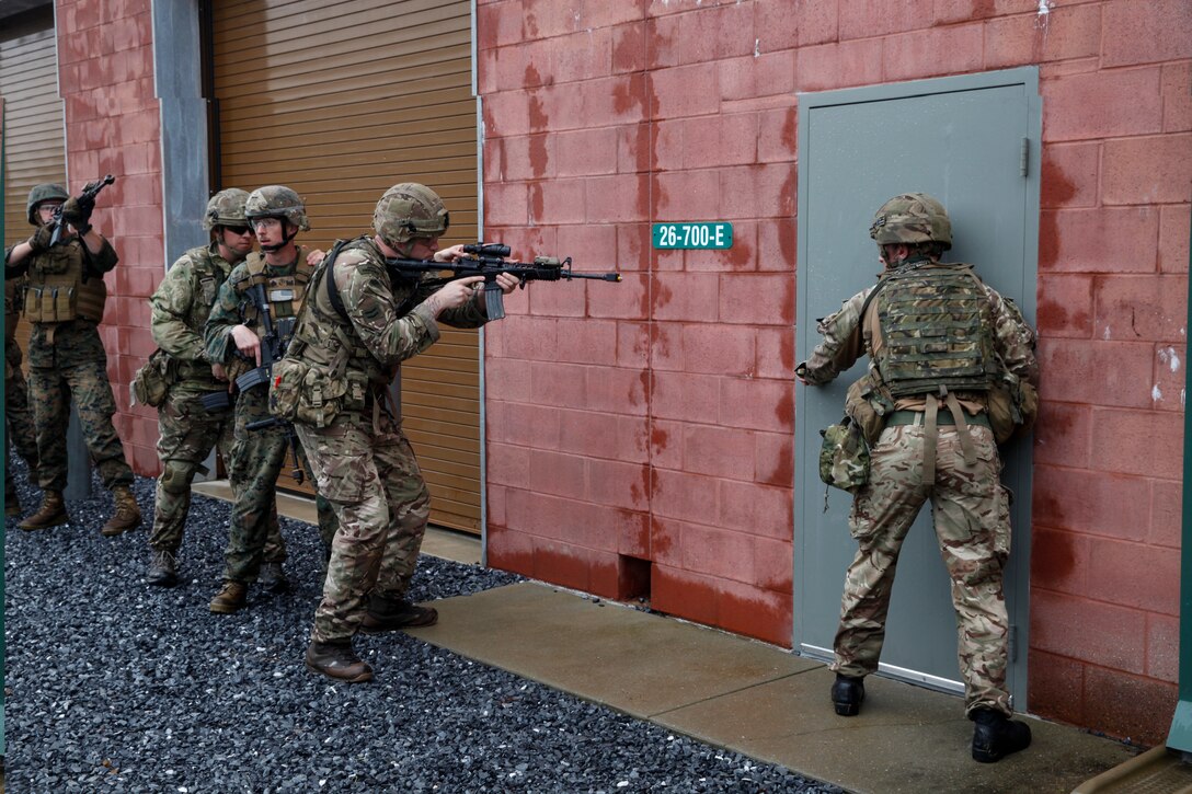 U.S. Marines with 6th Engineer Support Battalion, 4th Marine Logistics Group, and British commando’s with 131 Commando Squadron Royal Engineers, British Army, practice clearing a building at the military operations on urbanized terrain, or MOUT structure, during exercise Red Dagger at Fort Indiantown Gap, Pa., May 16, 2018.