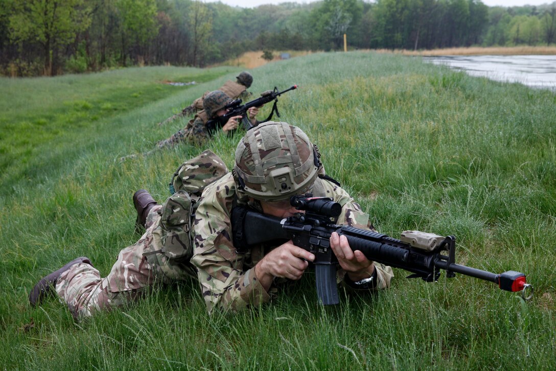 British Army Lance Cpl. Christopher C. Lane, commando with 131 Commando Squadron Royal Engineers, British Army, provides security with his fire team of U.S. Marines with 6th Engineer Support Battalion, 4th Marine Logistics Group, at the military operations on urbanized terrain, or MOUT structure, during exercise Red Dagger at Fort Indiantown Gap, Pa., May 16, 2018.