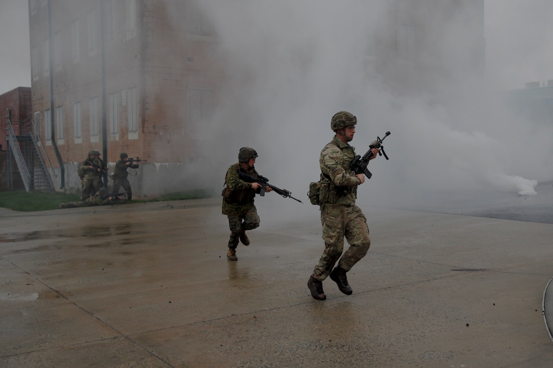 U.S. Marines with 6th Engineer Support Battalion, 4th Marine Logistics Group, and British commando’s with 131 Commando Squadron Royal Engineers, British Army, practice clearing a village at the military operations on urbanized terrain, or MOUT structure, during exercise Red Dagger at Fort Indiantown Gap, Pa., May 16, 2018.