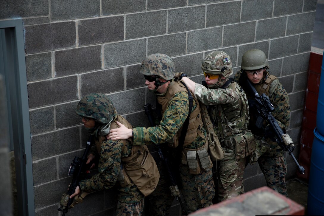 U.S. Marines with 6th Engineer Support Battalion, 4th Marine Logistics Group, and British commando’s with 131 Commando Squadron Royal Engineers, British Army, practice clearing a building at the military operations on urbanized terrain, or MOUT structure, during exercise Red Dagger at Fort Indiantown Gap, Pa., May 16, 2018.