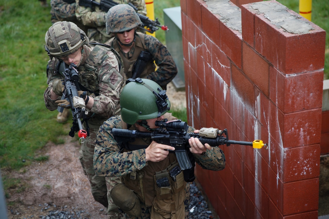 U.S. Marines with 6th Engineer Support Battalion, 4th Marine Logistics Group, and British commando’s with 131 Commando Squadron Royal Engineers, British Army, practice clearing a building at the military operations on urbanized terrain, or MOUT structure, during exercise Red Dagger at Fort Indiantown Gap, Pa., May 16, 2018.