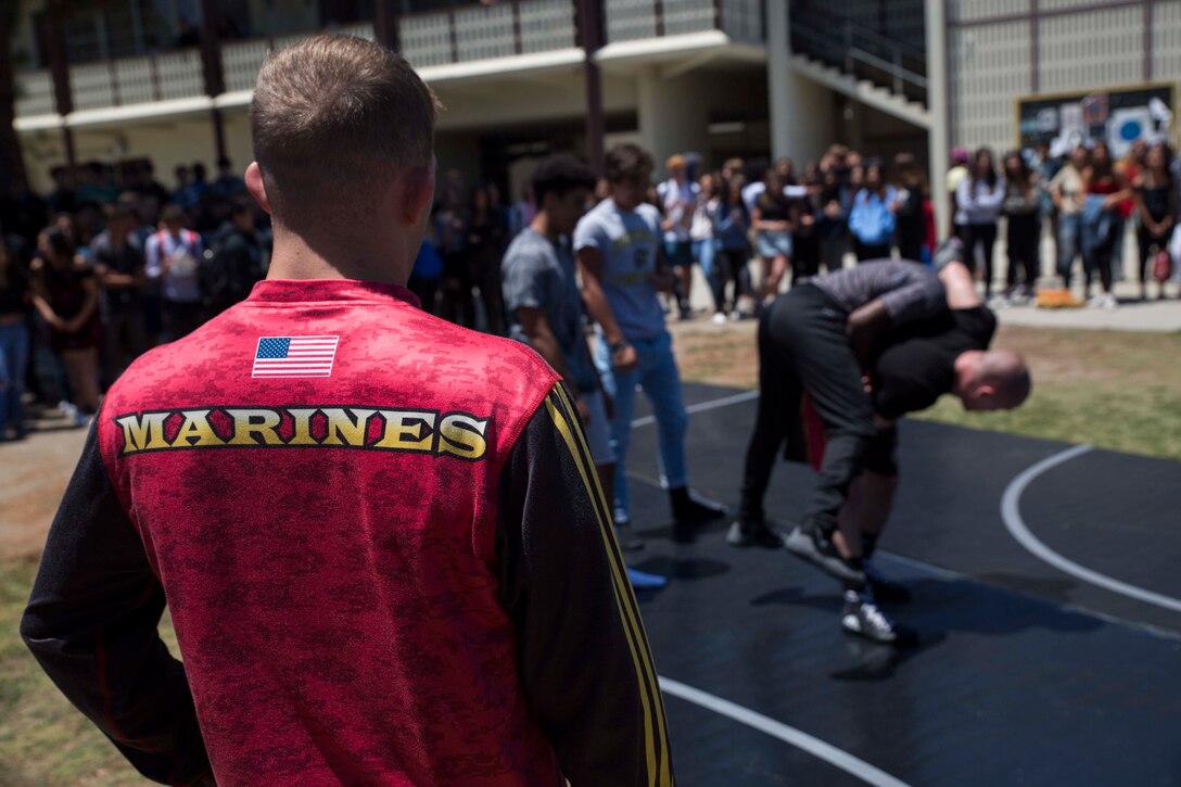 The U.S. Marines the All-Marine Wrestling Team, demonstrates different techniques to students during a lunch-time demonstration at the Palos Verdes Peninsula High School, Ca. May 16, 2018. The All-Marine Wrestling team held demonstrations and technique clinics in the southern California area to exhibit the Marine Corps values of Honor, Courage and Commitment to young students and aspiring wrestlers. (U.S. Marine Corps photo by Sgt. Taylor Schrick)
