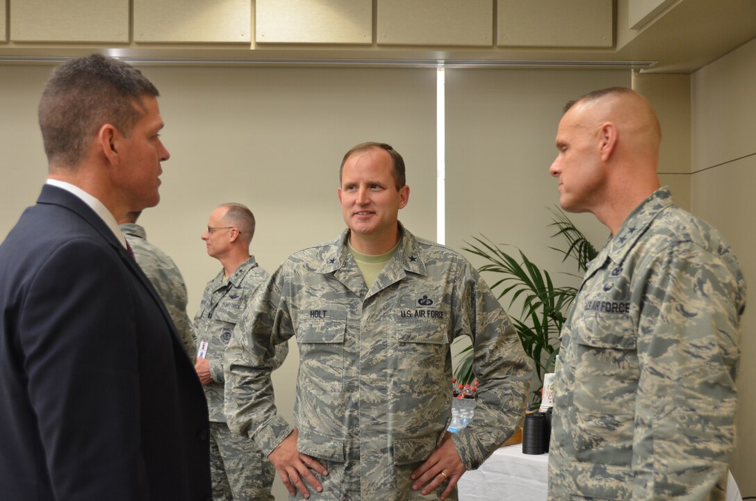 From left, Assistant Secretary of the Air Force for Installations, Environment and Energy John Henderson talks to Air Force Installation Contracting Agency Commander Brig. Gen. Cameron Holt and Air Force Installation and Mission Support Center Commander Maj. Gen. Brad Spacy at the AFIMSC general officer and senior executive service summit May 15 in San Antonio.  In addition to the summit, about 30 senior Air Force leaders also attended the Installation and Mission Support Weapons and Tactics Conference to listen to proposed solutions to some of the services greatest agile combat support challenges. (U.S. Air Force photo by Armando Perez)