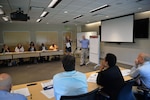 Employees from Naval Sea Systems Command "swarm" a problem to come up with a solution during the high-velocity learning (HVL) summit at Naval Surface Warfare Center, Carderock Division, May 15, 2018, in West Bethesda, Md.