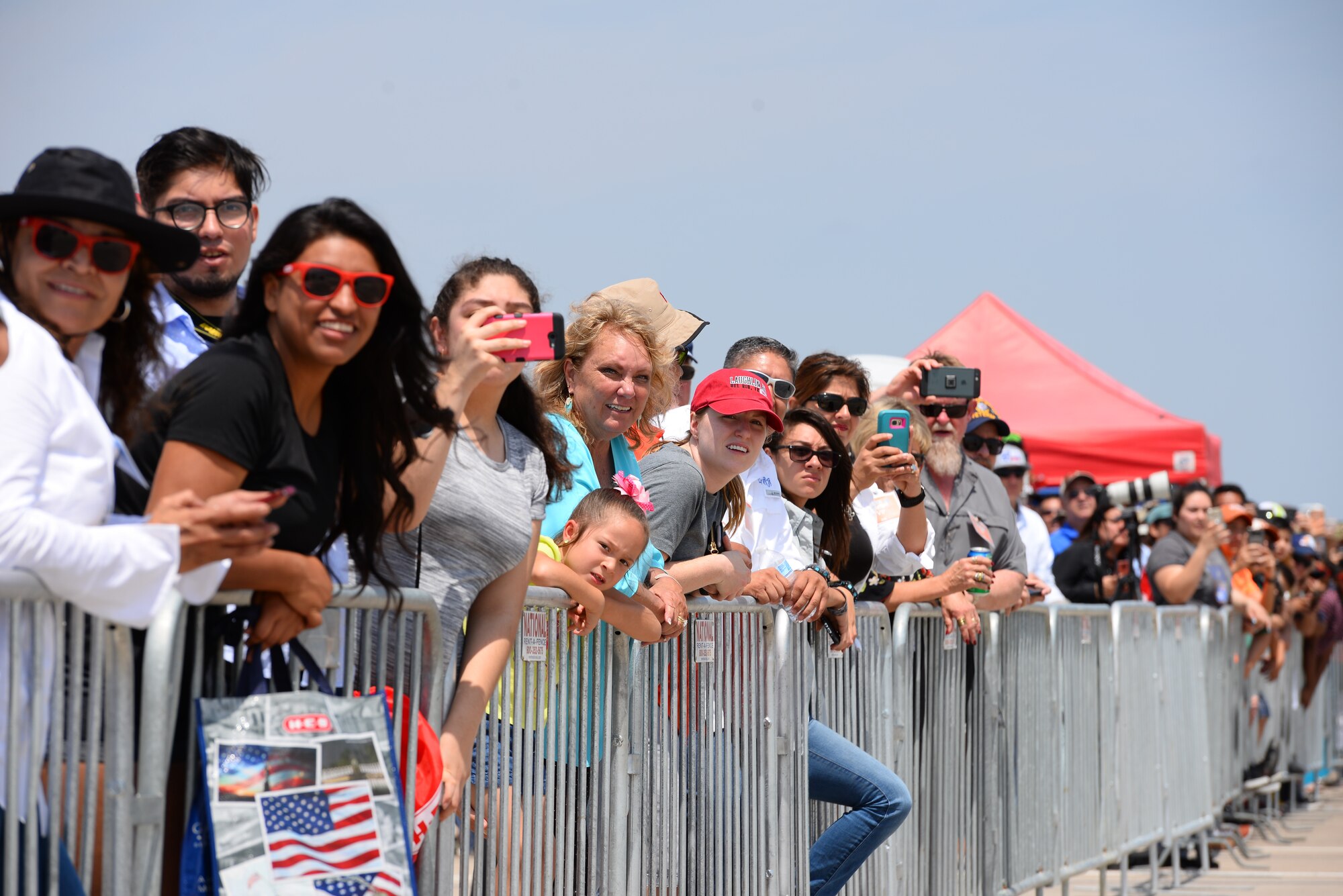 Attendees of Laughlin Air Force Base’s open house and airshow, “Fiesta of Flight,” watch as performers navigate the Texas skies, May 12, 2018. With more than 20,000 people in attendance, aircraft from various generations displayed their aerial capabilities. (U.S. Air Force photo by Senior Airman Benjamin N. Valmoja)
