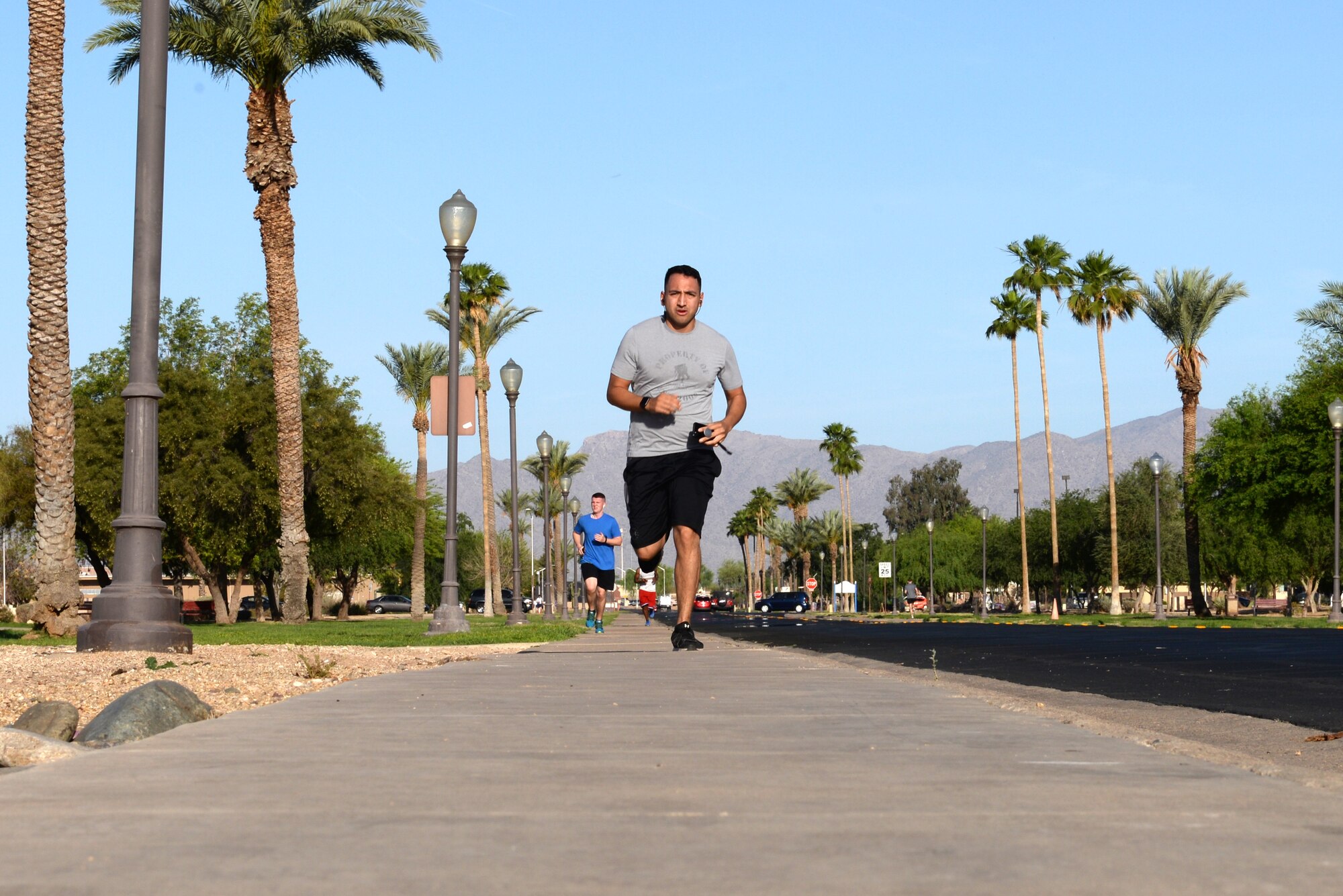 Luke Airmen run down the road during the Air Force Assistance Fund 5-kilometer Fun Run May 11, 2018, at Luke Air Force Base, Ariz. The run helped to raise awareness for the AFAF campaign that offers financial assistance to Active Duty and retired Airmen and their families in the form of small loans, education loans and grants, and living conditions. (U.S. Air Force photo by Senior Airman Ridge Shan)