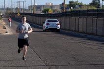 Participants in the Air Force Assistance Fund 5-kilometer Fun Run approach the finish line May 11, 2018, at Luke Air Force Base, Ariz. In 2017, Airmen and their families assigned to Air Education and Training Command received more than 200 thousand dollars in AFAF assistance.  (U.S. Air Force photo by Senior Airman Ridge Shan)