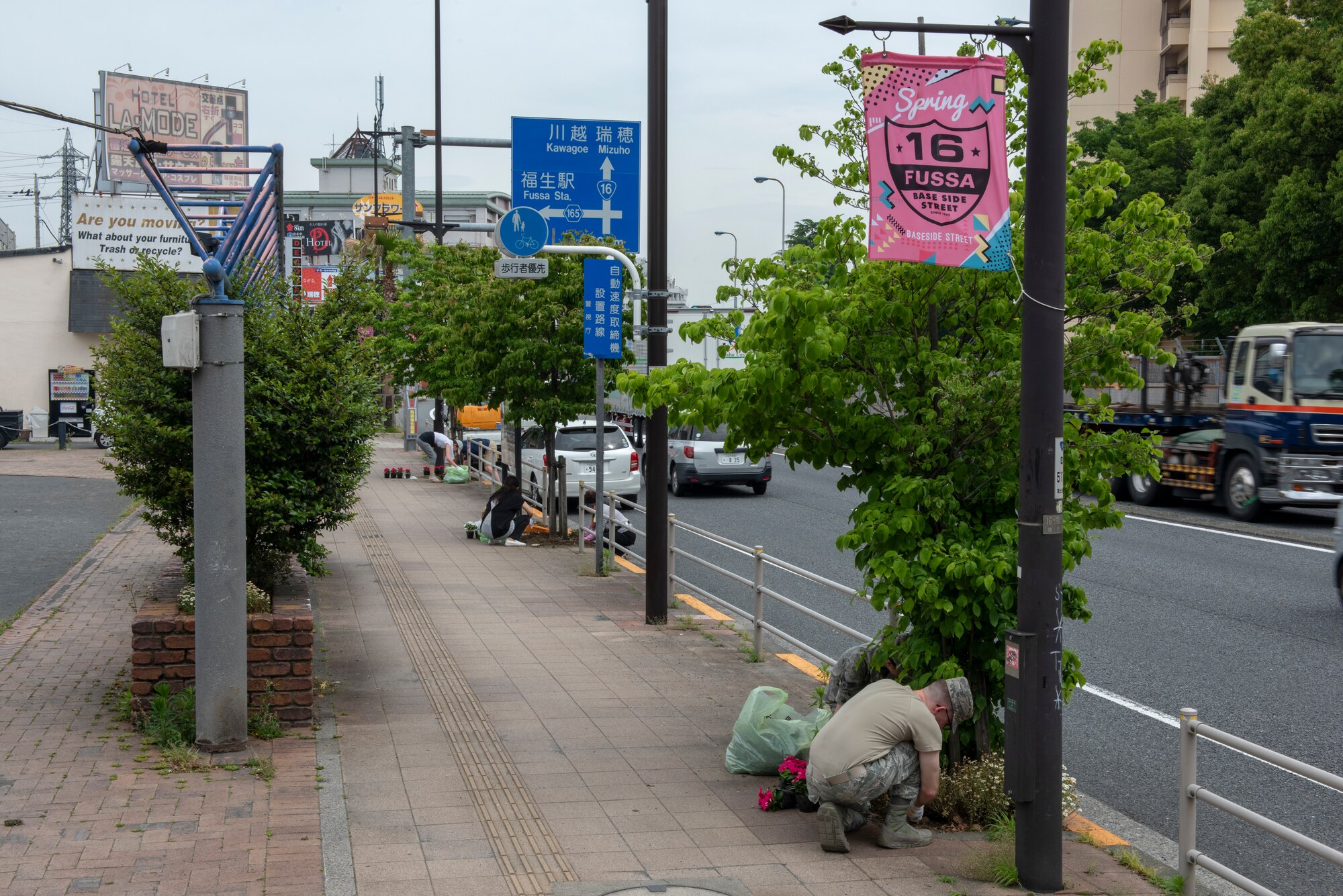Volunteers from both Yokota Air Base, Japan and the City of Fussa plant flowers along Route 16 as part of the Fussa Beautification Porject in Fussa, Japan, May 17, 2018.