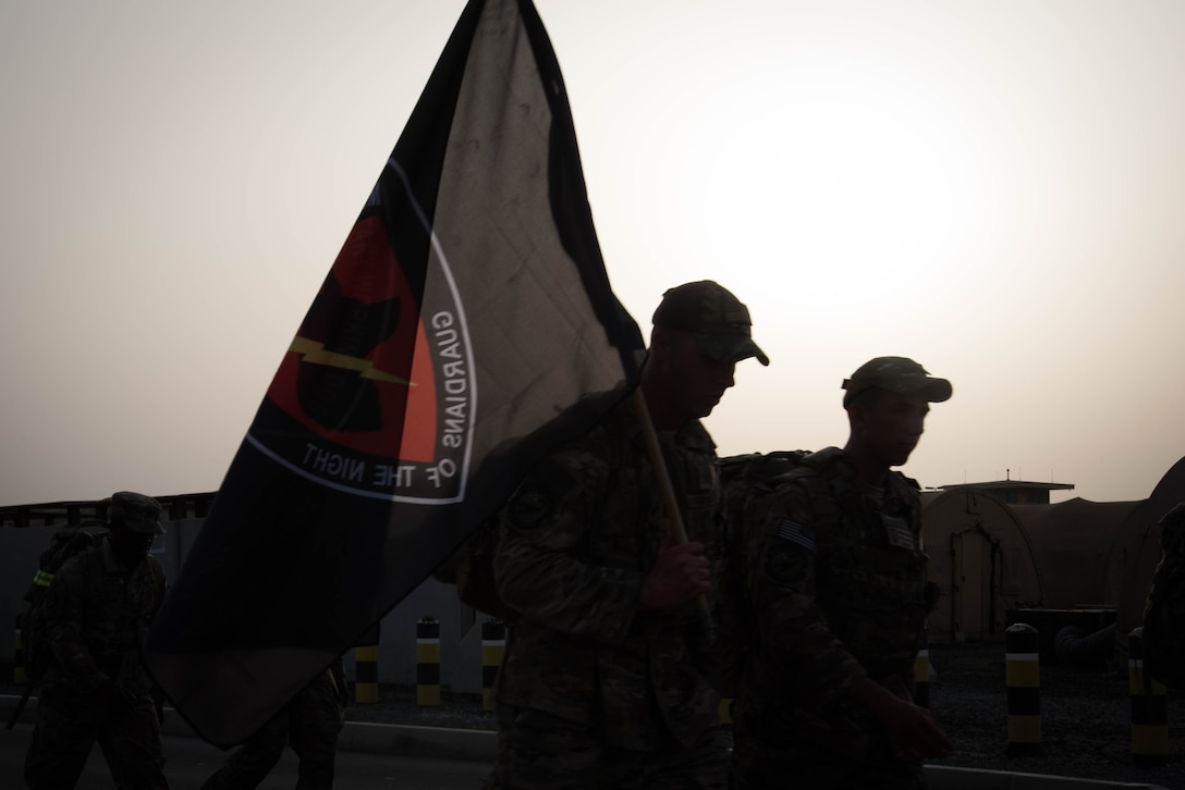 Members from Al Dhafra Air Base participate in a 5k run and ruck march in honor of National Police Week on Al Dhafra Air Base, United Arab Emirates, May 18, 2018. Participants carried bricks with names of fallen security forces officers.