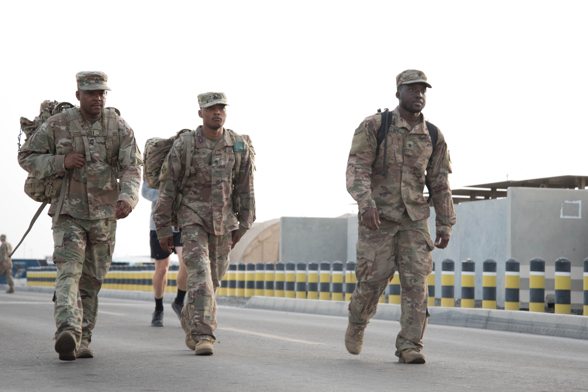 Members from Al Dhafra Air Base participate in a 5k run and ruck march in honor of National Police Week on Al Dhafra Air Base, United Arab Emirates, May 18, 2018. Participants carried bricks with names of fallen security forces officers.