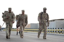 Members from Al Dhafra Air Base participate in a 5k run and ruck march in honor of National Police Week on Al Dhafra Air Base, United Arab Emirates, May 18, 2018. Participants carried bricks with names of fallen security forces officers.