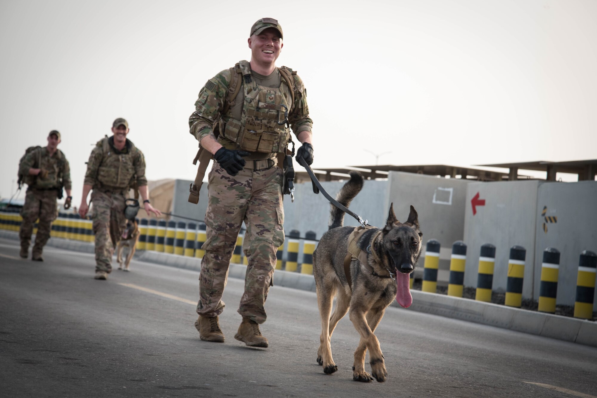 Members from Al Dhafra Air Base participate in a 5k run and ruck march in honor of National Police Week on Al Dhafra Air Base, United Arab Emirates, May 18, 2018. Participants carried bricks with names of fallen security forces officers.