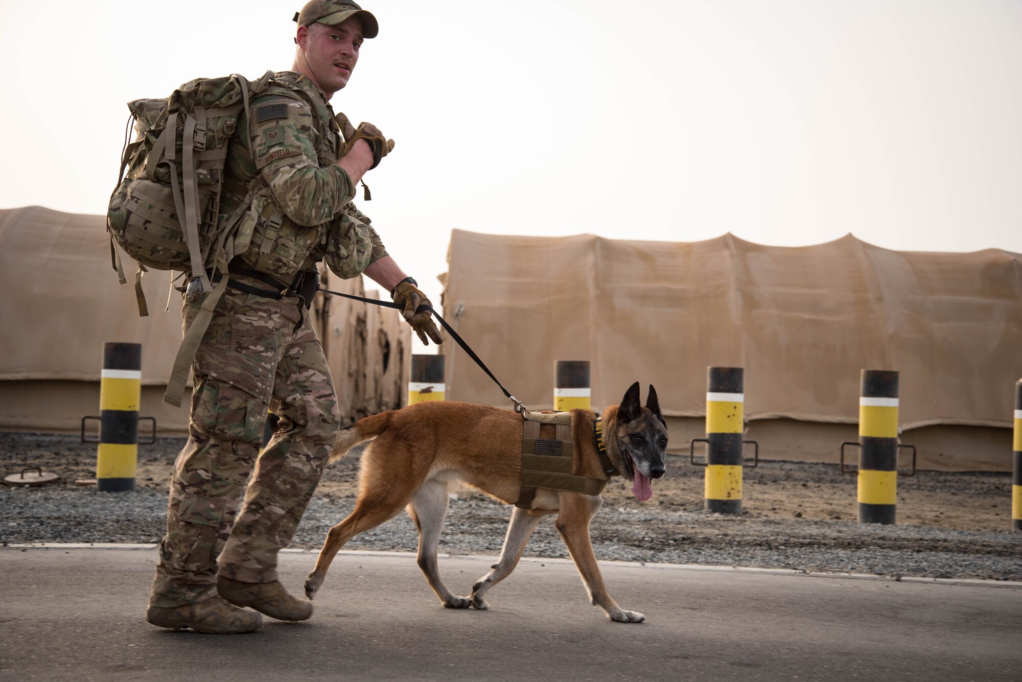 Members from Al Dhafra Air Base participate in a 5k run and ruck march in honor of National Police Week on Al Dhafra Air Base, United Arab Emirates, May 18, 2018. Participants carried bricks with names of fallen security forces officers.