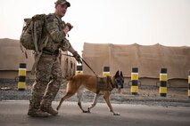 Members from Al Dhafra Air Base participate in a 5k run and ruck march in honor of National Police Week on Al Dhafra Air Base, United Arab Emirates, May 18, 2018. Participants carried bricks with names of fallen security forces officers.