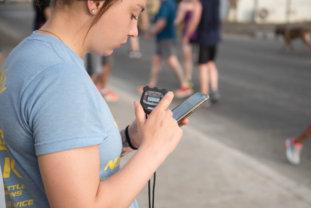 Members from Al Dhafra Air Base participate in a 5k run and ruck march in honor of National Police Week on Al Dhafra Air Base, United Arab Emirates, May 18, 2018. Participants carried bricks with names of fallen security forces officers.