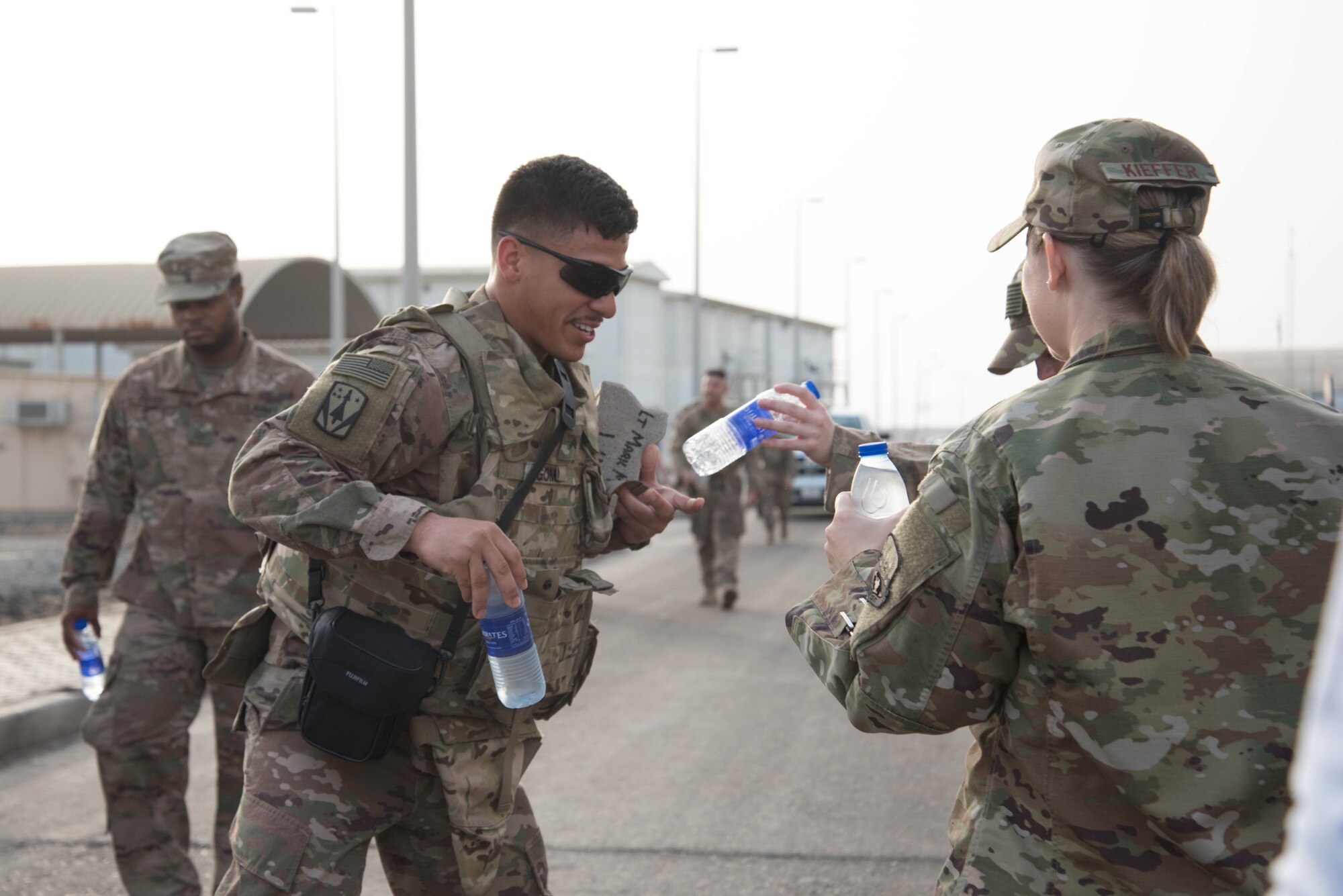 Members from Al Dhafra Air Base participate in a 5k run and ruck march in honor of National Police Week on Al Dhafra Air Base, United Arab Emirates, May 18, 2018. Participants carried bricks with names of fallen security forces officers.
