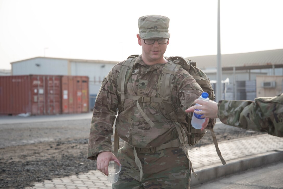 Members from Al Dhafra Air Base participate in a 5k run and ruck march in honor of National Police Week on Al Dhafra Air Base, United Arab Emirates, May 18, 2018. Participants carried bricks with names of fallen security forces officers.